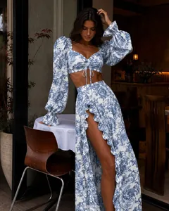 Elegant puff sleeves and high-slit ruffled skirt detail in blue toile de jouy pattern
