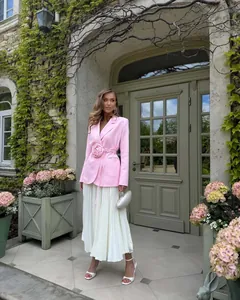 Elegant pink blazer jacket featuring a 3D flower waist detail and pleated skirt