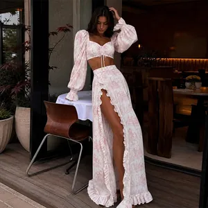 Detailed view of a two-piece floral print set featuring a crop top and slit maxi skirt