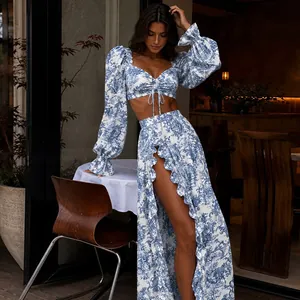 Elegant blue and white floral print two-piece set featuring tie-front top and ruffle skirt