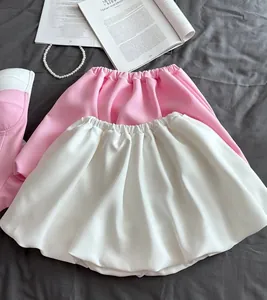 Fashionable summer set featuring a pink tube top and a white bubble puffy mini skirt