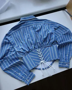 Blue and white striped cropped long sleeve shirt featuring corset lace-up waist