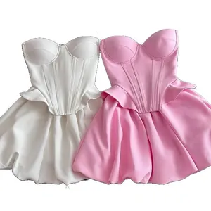 Elegant strapless corset top and puff bubble mini skirt two-piece set in white and pink.