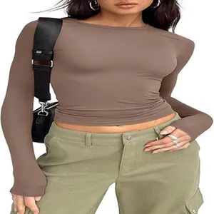 Detailed view of women's slim fit long sleeve crew neck T-shirt in taupe brown fabric