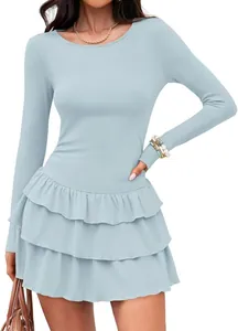Close-up detail of light blue long-sleeved knitted dress with tiered ruffle skirt