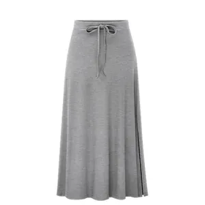 Close-up of a grey high-waisted knitted midi skirt with side slit detail