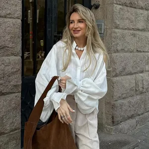 Elegant white oversized button-down shirt with stylish lantern sleeves and lapel collar for women