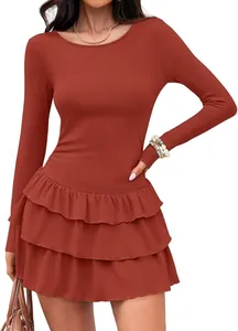 Elegant rust-colored ribbed knit dress featuring long sleeves and a tiered ruffle skirt.