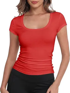 Detail view of a vibrant red slim-fit short sleeve t-shirt with a stylish scoop neckline