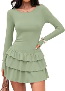 Detail shot of sage green long sleeve knit dress featuring tiered ruffle skirt tiers