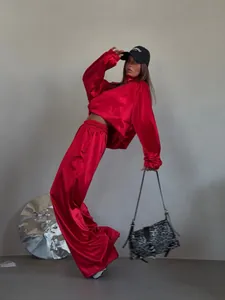 Fashion red satin tracksuit with cropped sweatshirt and wide-leg pants
