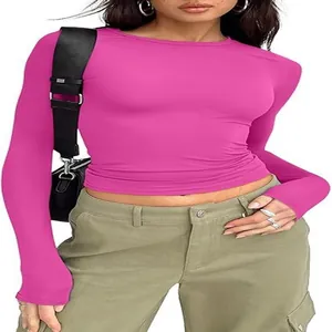 Detailed view of a slim fit round neck long sleeve T-shirt in vibrant pink jersey