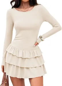 Close-up of elegant beige long-sleeved knitted dress featuring a layered ruffled skirt