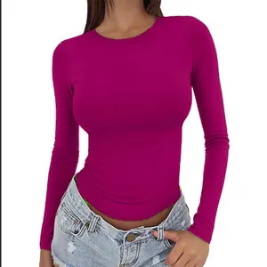 Detailed view of women's fuchsia slim-fit long-sleeve T-shirt with a classic crewneck.