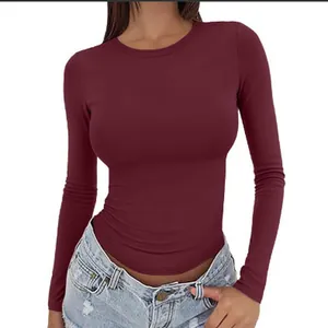 Elegant women's slim fit long sleeve round neck T-shirt in professional solid maroon