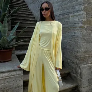 Elegante completo giallo 3 pezzi con cardigan lungo e pantaloni a gamba larga