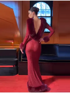 Back view of an elegant burgundy rhinestone mermaid long dress with luxury faux fur trim