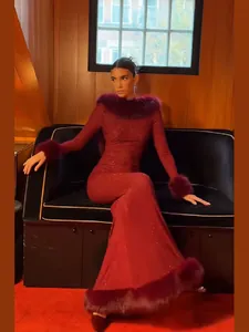 Elegant burgundy mermaid evening gown with rhinestones and faux fur trim details