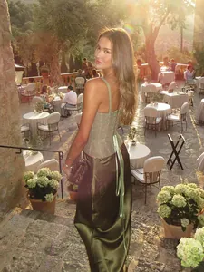 Elegant green lace corset top paired with a silky olive satin maxi skirt for summer events