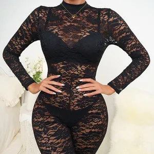 Close-up detail showing the intricate black lace floral pattern and sheer mesh of this jumpsuit.