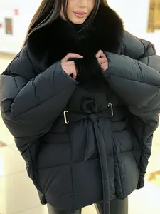Close-up of black thickened winter coat featuring a luxurious detachable fur collar