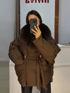 Close-up of brown winter puffer jacket with luxurious removable faux fur collar