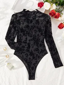 Close-up of black mesh flocked bodysuit with elegant floral patterns and long sleeves.
