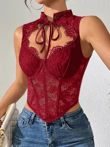 Detailed view of red lace corset top with neck tie and boning structure
