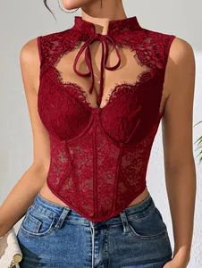 Close-up detail of intricate burgundy lace texture on a corset top with front tie-up