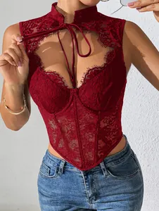 Detailed view of red lace corset top with fishbone structure and delicate scalloped edges