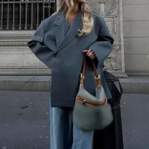 Chic oversized gray blazer with unique V-neck slanted lapel for a modern street look.