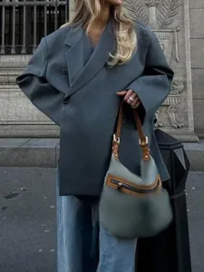 Chic oversized grey V-neck blazer featuring a unique diagonal wrap-front closure and wide sleeves.