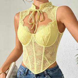 Close-up of yellow floral lace corset top showing fishbone structure and tie-neck