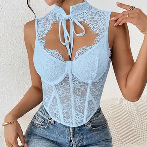 Detail of light blue lace corset top with fishbone underwire and hollow-out chest.