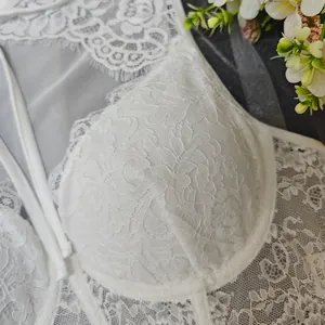 Detailed view of white floral lace and underwire on a corset-style bustier top.