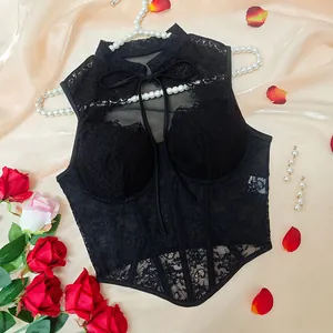 Detailed view of the black lace fishbone corset top with ribbon tie and mesh texture.