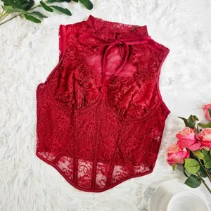 Detailed view of the red floral lace corset top with underwire and boning.