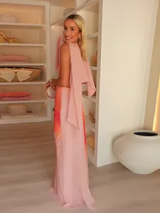 Elegant V-neck printed pink maxi dress for summer fashion in a luxury closet setting.