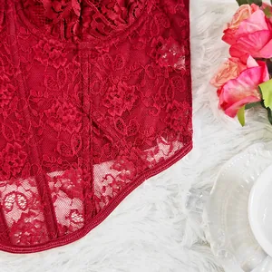 Detailed view of the intricate red floral lace and boning on a structured corset top.