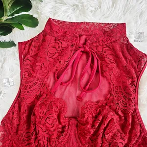 Detailed view of red floral lace bodice with neck tie and keyhole cutout design