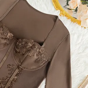 Close-up of brown lace bodysuit with corset detail on white faux fur