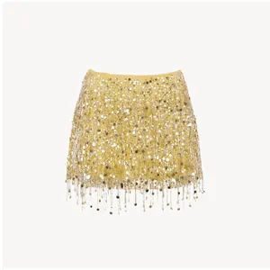 Detailed close-up view of yellow sequin mini skirt with sparkling silver fringe accents