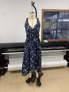 Detailed view of navy blue floral halter midi dress with V-neck on a size S mannequin