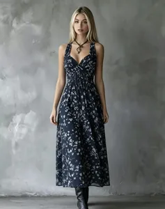 Full-length detail of a navy floral halter midi dress with a flattering V-neckline