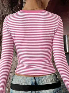 Back view detail of a pink and white horizontal striped slim-fit long-sleeve T-shirt.