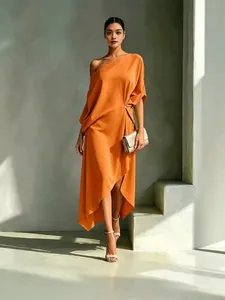 Elegant one-shoulder orange cotton linen dress with a stylish asymmetrical hem