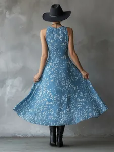 Back view of a stunning blue bohemian floral sleeveless summer dress on a model