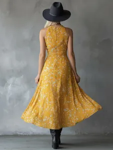Elegant back view of a yellow bohemian floral maxi dress with a flowing skirt for summer