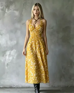 Detailed front view of a yellow floral V-neck maxi dress with a slimming waist design.