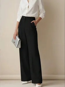 Full view of elegant high-waisted black wide-leg trousers for professional minimalist style